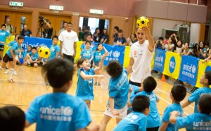 Adnan Januzaj playing dodgeball with children at a United for UNICEF playday in Hong Kong, during the Manchester United pre-season tour, July 2013. The event helped to raise awareness of the importance of sport and play for children's health and development. © UNICEF HK/ 2013