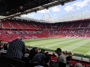 Empty Stretford End and Sir Alex Ferguson Stand at Old Trafford