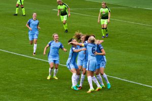 Jennifer Beattie celebrates her goal with Man City Women team mates