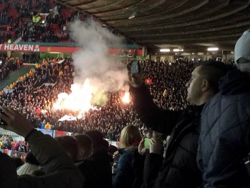 Feyenoord fans set off flares at Old Trafford in their Europa League game against Manchester United