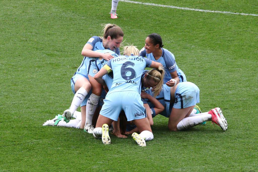 Crowd of players bury Melissa Lawley after she scores her first goal for Man City Women