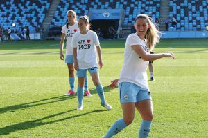 Jill Scott, Keira Walsh and Abbie McManus wear We Love Manchester T-Shirts before the Manchester City Women v Chelsea game