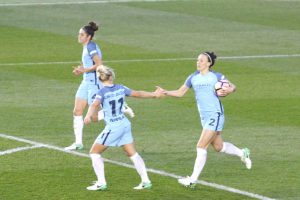 Lucy Bronze celebrates her equaliser with Izzy Christiansen
