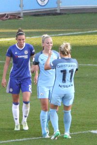 Toni Duggan celebrates her goal with Izzy Christiansen while Deanna Cooper of Chelsea Ladies walks by