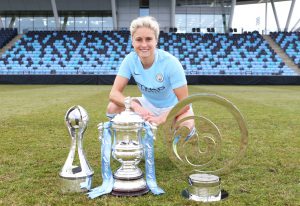 Steph Houghton with the three trophies Manchester City Women won during the 16-17 season - she will lead City into the Toulouse International Ladies Cup pre-season tournament