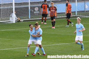 Phil Foden congratulates Joel Latibeaudiere on his goal for Man City U19 against Shakhtar Donetsk