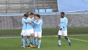 Nabil Touaizi congratulates Brahim Diaz on scoring Manchester City U19's first half goal against Napoli U19