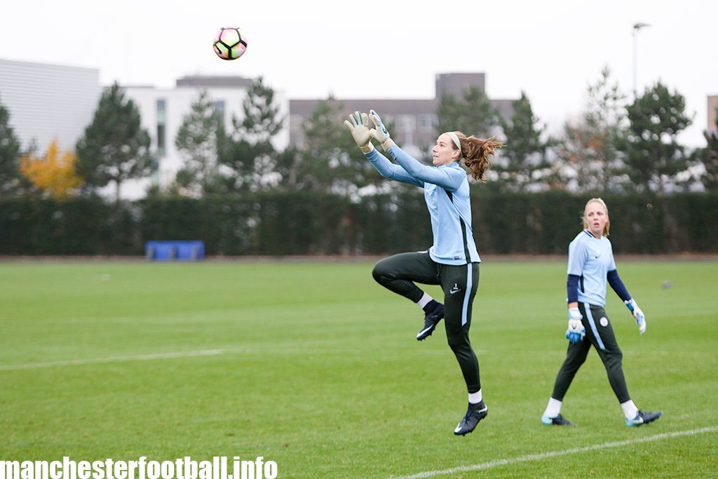 Manchester City goalkeeper Karen Bardsley in catching practice with Ellie Roebuck looking on