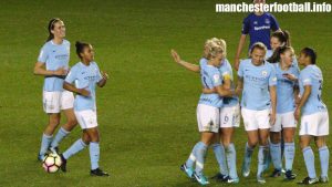 Izzy Christiansen celebrates her goal against Everton Ladies with Steph Houghton and team mates