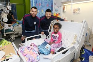 Sergio Aguero and Nicolas Otamendi visit patients at Royal Manchester Children's Hospital