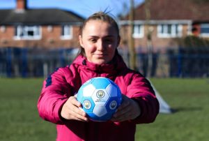 Manchester City's Georgia Stanway holding a football marked up with SameGoals