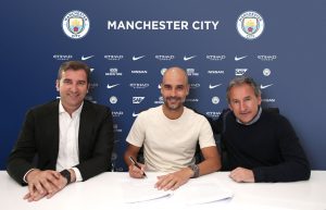 Ferran Soriano (left) and Txiki Begiristain (right) with Pep Guardiola as he signs his new Man City contract which runs to 2021