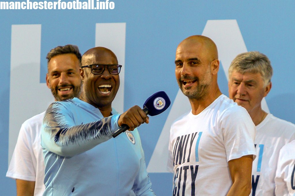 Mike Wedderburn interviews Pep Guardiola on stage at the Man City title parade on May 14, 2018