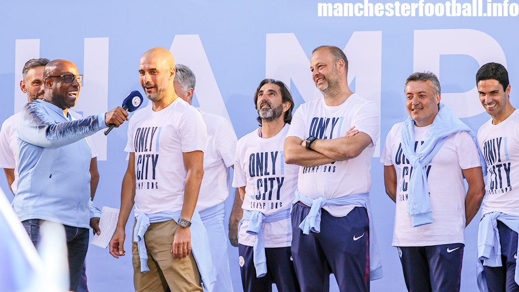 Pep Guardiola and his coaching staff (including Domenec Torrent - second right - and Mikel Arteta - far right) at the Manchester City title Parade on May 14, 2018