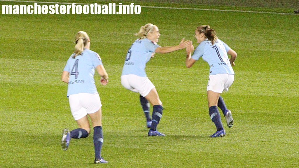 Gemma Bonner and Steph Houghton rush to celebrate with goalscorer against Reading - Georgia Stanway