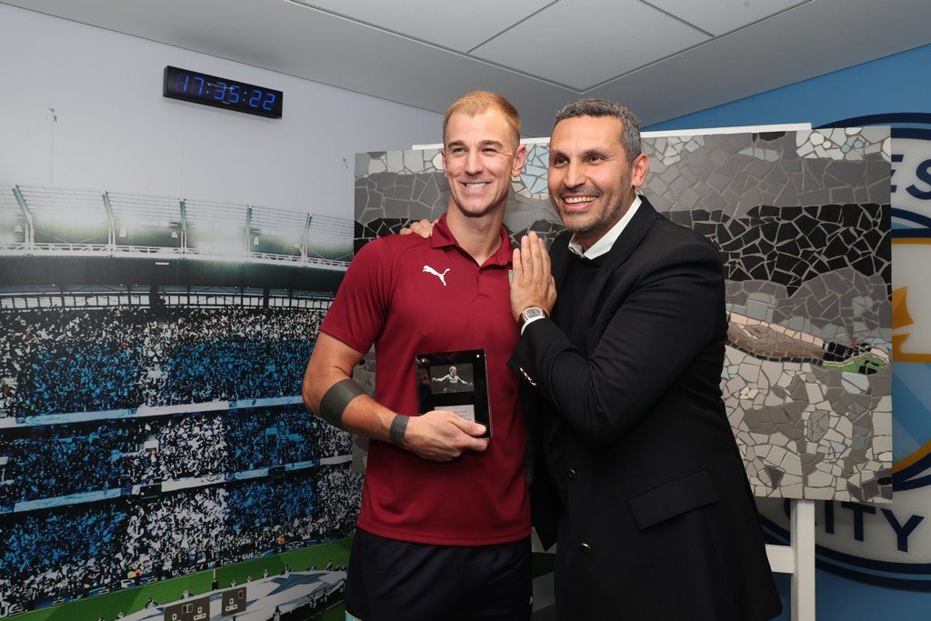 Joe Hart is presented with a replica mosaic by Man City Chairman Khaldoon Al Mubarak after his first return to the club as a Burnley player