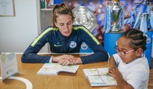 Jill Scott works through myHappymind booklet with pupil from local primary school