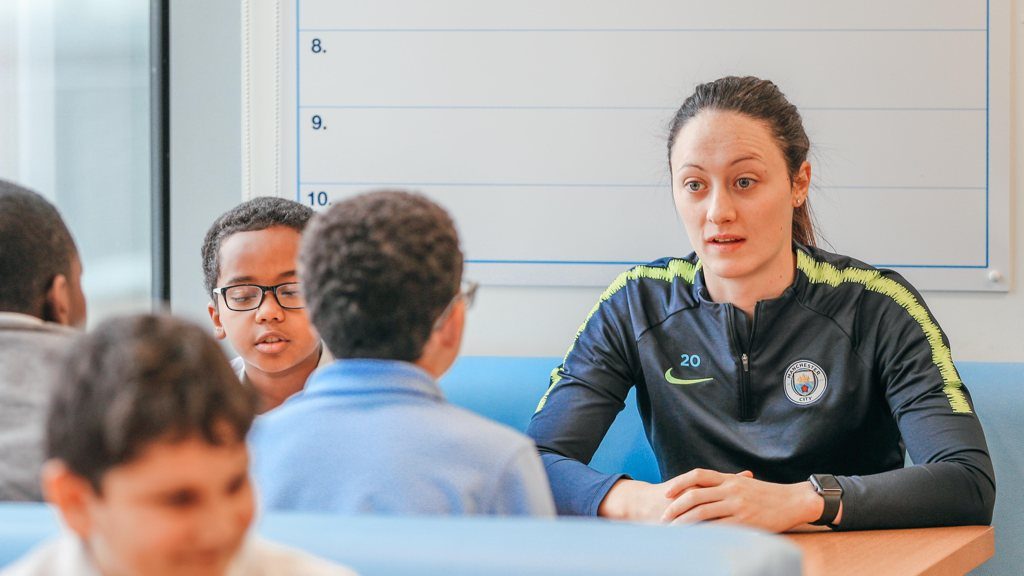 Megan Campbell working with primary school children during a myHappymind lesson