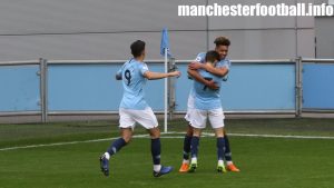 Nabil Touaizi-Zoudbi runs over to join goalscorer Felix Nmecha celebrating with Benjamin Garre for Man City EDS vs Blackburn Rovers U23