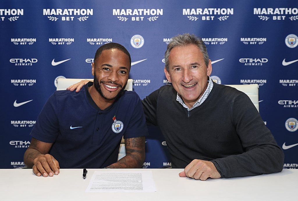 Raheem Sterling with Txiki Begiristain after signing a new three year contract extension with Manchester City