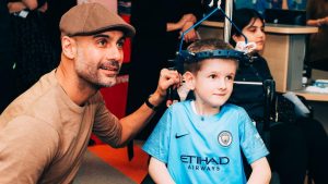 Pep Guardiola shares moment with patient at Royal Manchester Children's Hospital