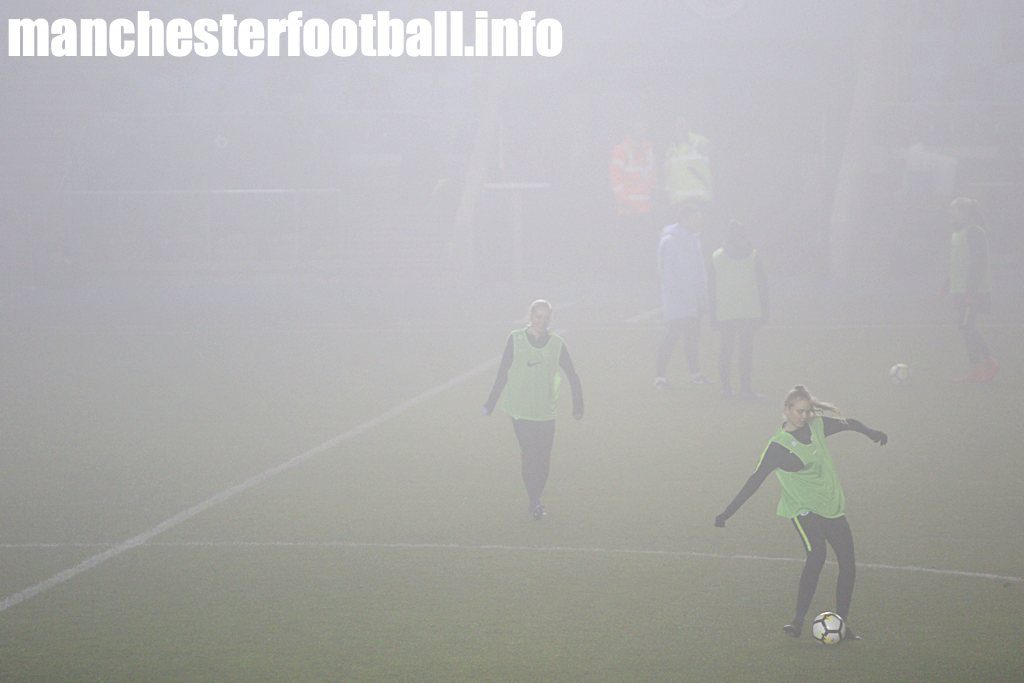 Pauline Bremer (centre) and Esme Morgan (right) keeping warm in the fog at Man City vs Brighton on January 10 2019