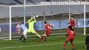 Manchester City defender Taylor Harwood-Bellis volleys the ball past Nottingham Forest's Michael Statham from close range