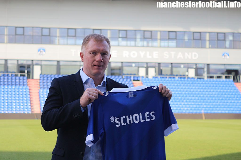 Paul Scholes standing in front of the pitch at Oldham Athletic's Boundary Park Stadium