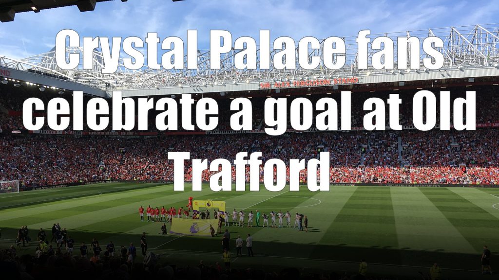 Crystal Palace fans celebrate a goal at Old Trafford in a 2-1 away win