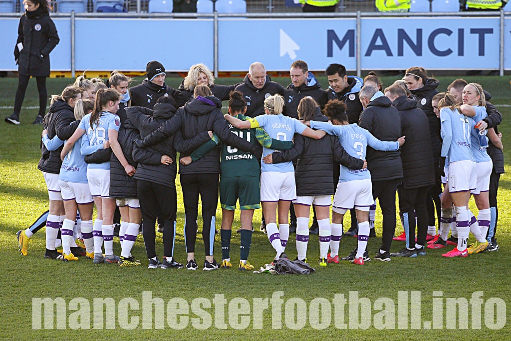 Alan Mahon in the player huddle at the end of the Manchester City 10, Ipswich Town 0 game