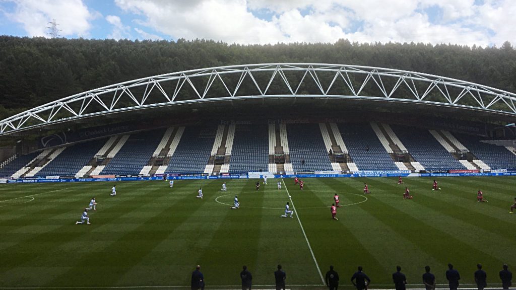 Huddersfield Town vs Wigan Athletic - Players take a knee at John Smiths Stadium prior to kick off on Saturday June 20 2020