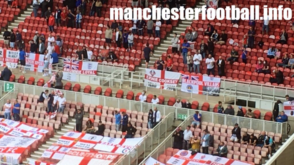 England vs Romania Oldham Athletic fans with Ernie Cooksey flag - Riverside Stadium Friendly - Sunday June 6 2021