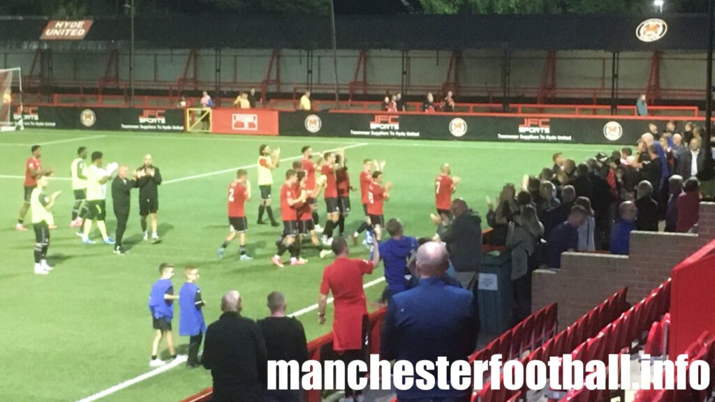 Hyde United applauding fans in Shed End