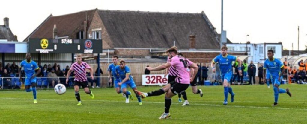 Josh Hancock scoring the winning penalty. Photo by Oli Biddle