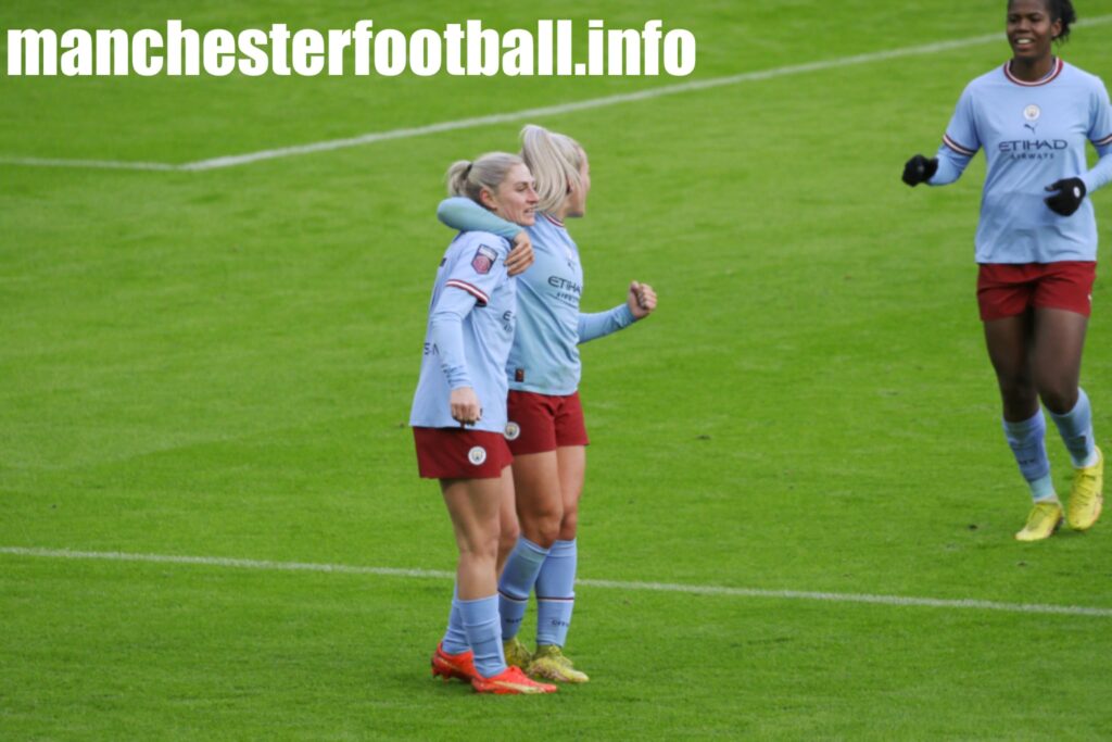 Laura Coombs and Lauren Hemp celebrate Man City equaliser against United