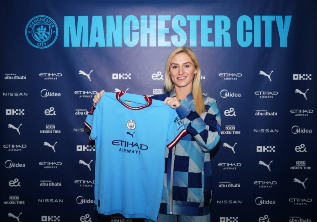 Laura Coombs with a Manchester City shirt