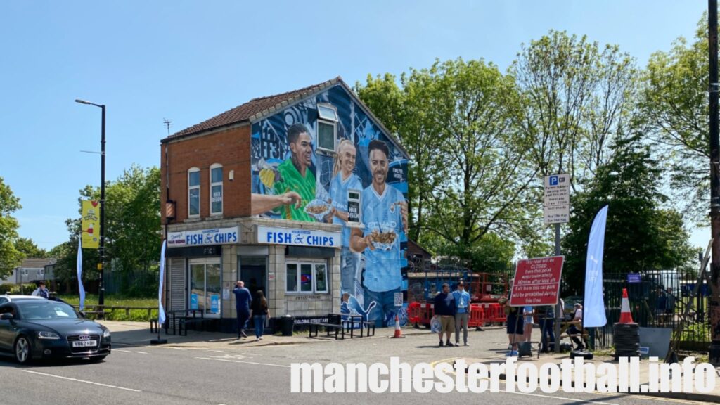 Mural on the side of a fish and chip shop opposite the Etihad Stadium