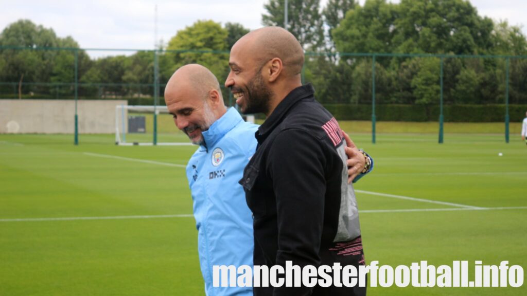 Manchester City manager Pep Guardiola greets Thierry Henry